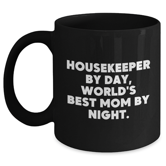 Housekeeper Gifts from Family, Funny 'Housekeeper By Day, World's Best Mom By Night.' Black Coffee Mug for Graduation, Unique Gifts for Housekeeper - Main