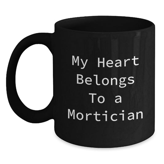 Funny Mortician Gifts from Friends, Unique Black Coffee Mugs for Mortician Lovers with Inspirational Quote 'My Heart Belongs To A Mortician', Graduation Gifts for Men and Women - Main