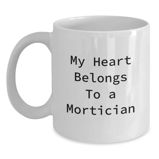 Funny Mortician White Coffee Mug, 'My Heart Belongs To A Mortician' Quote, Gifts from Friends or Family for Mortician Graduation, Unique White Coffee Mug for Men or Women - Main