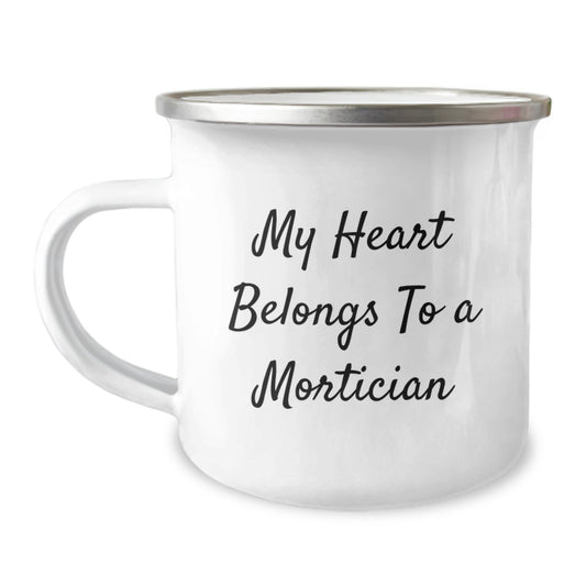 Mortician Gifts, Funny Quote Mug, Gifts from Friends for Mortician, 12 oz Camping Mug, Graduation Unique Gifts, My Heart Belongs To A Mortician - Image 1