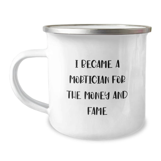 Mortician Humor Gifts from Friends and Family, Funny Camping Mug for Mortician Graduation, 'I Became A Mortician For The Money And Fame' Quote - Image 1