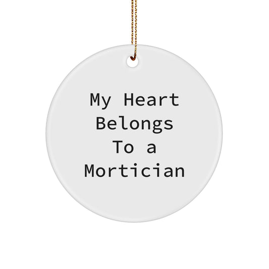 Funny Mortician Gifts, 'My Heart Belongs To A Mortician' Circle Ornament, White, 2.75" Tall, Christmas Unique Gifts from Friends, Family, or Coworkers for Mortician - Image 1