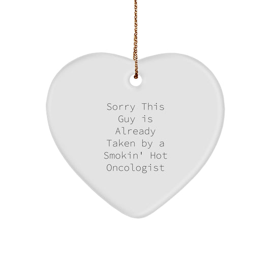 Oncologist Gifts from Friends, Gifts for Oncologist, Heart Ornament Christmas Unique Presents, 'Sorry This Guy Is Already Taken By A Smokin' Hot Oncologist' Quote, Funny Heart Shaped Ornament - Image 1