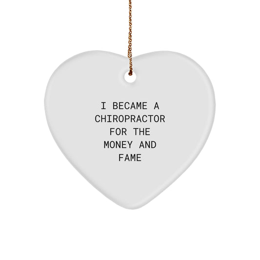 Chiropractor Gifts for Christmas - Funny Quote 'I Became A Chiropractor For The Money And Fame' Heart Ornament, Gifts from Friends to Family - Image 1