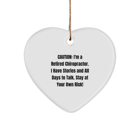 Funny Chiropractor Gifts from Friends to Family, Caution: I'm A Retired Chiropractor. I Have Stories And All Days To Talk. Stay At Your Own Risk! Heart Ornament for Christmas - Image 1