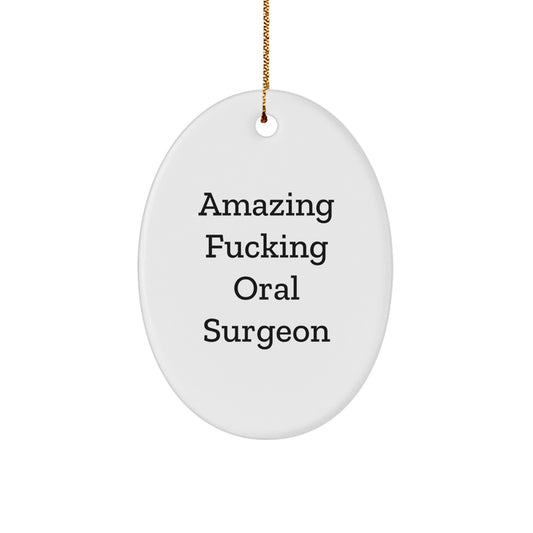 Funny Oral Surgeon Gifts from Friends for Christmas - Oval Ornament with 'Amazing F--king Oral Surgeon' Quote - Image 1
